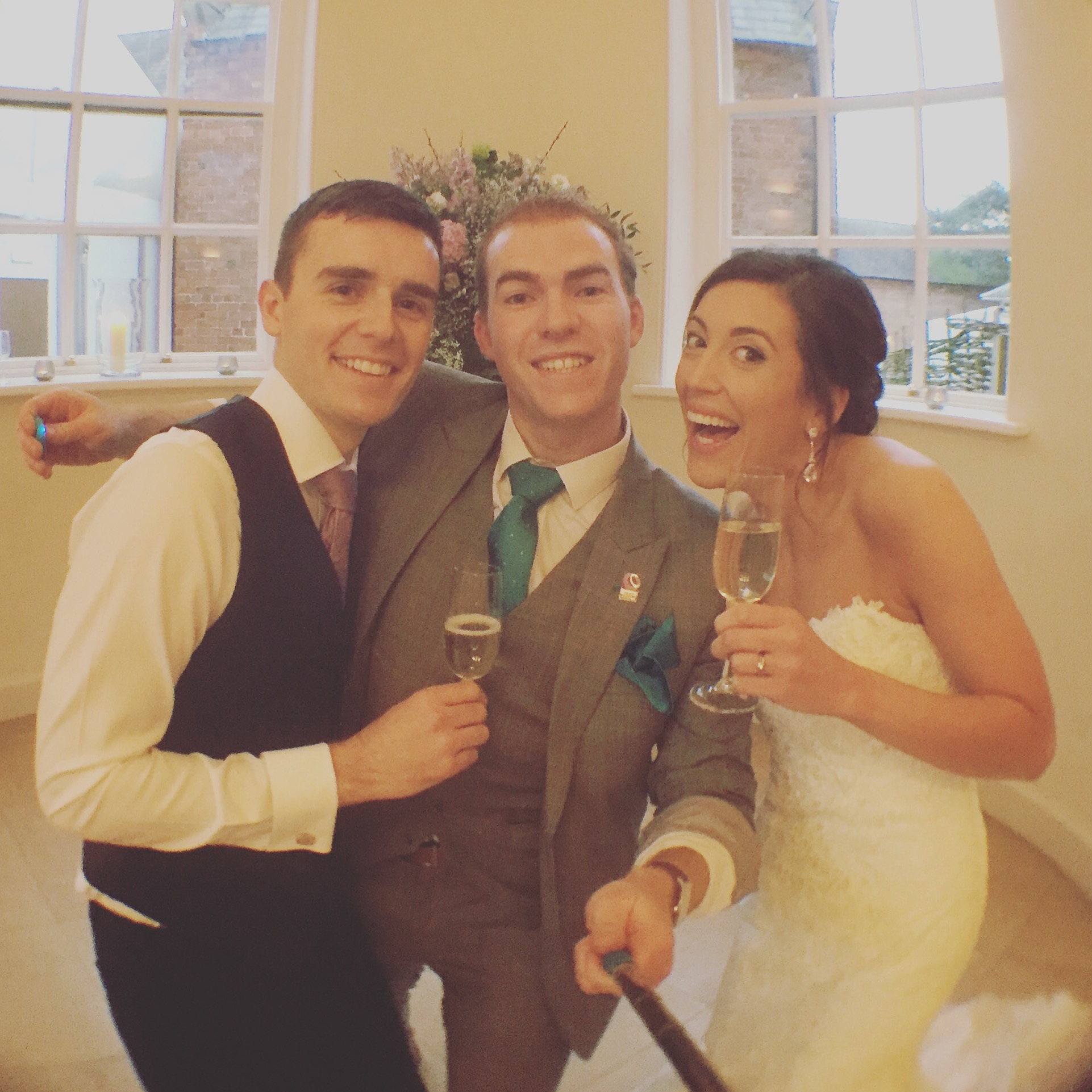 bride and groom selfie with manchester wedding magician sam fitton at iscoyd park