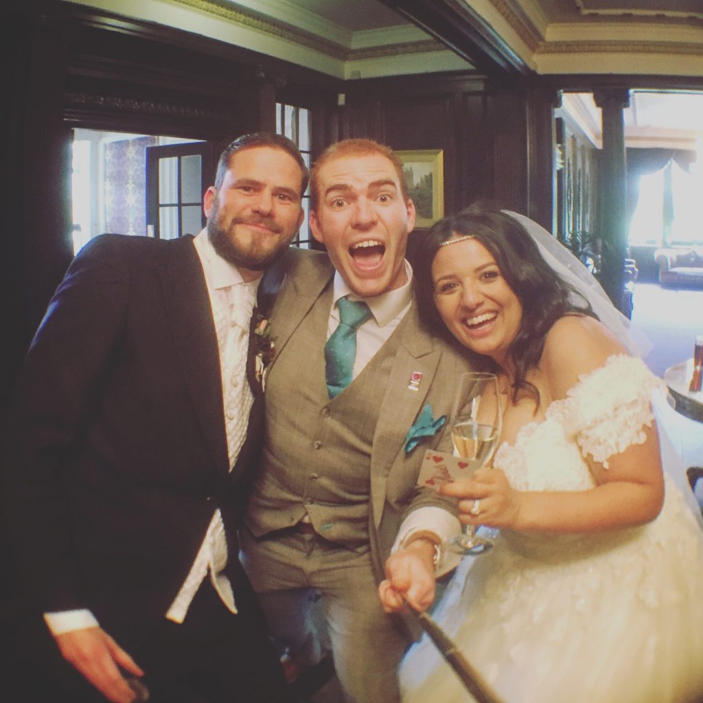 eaves hall magician sam fitton with bride and groom